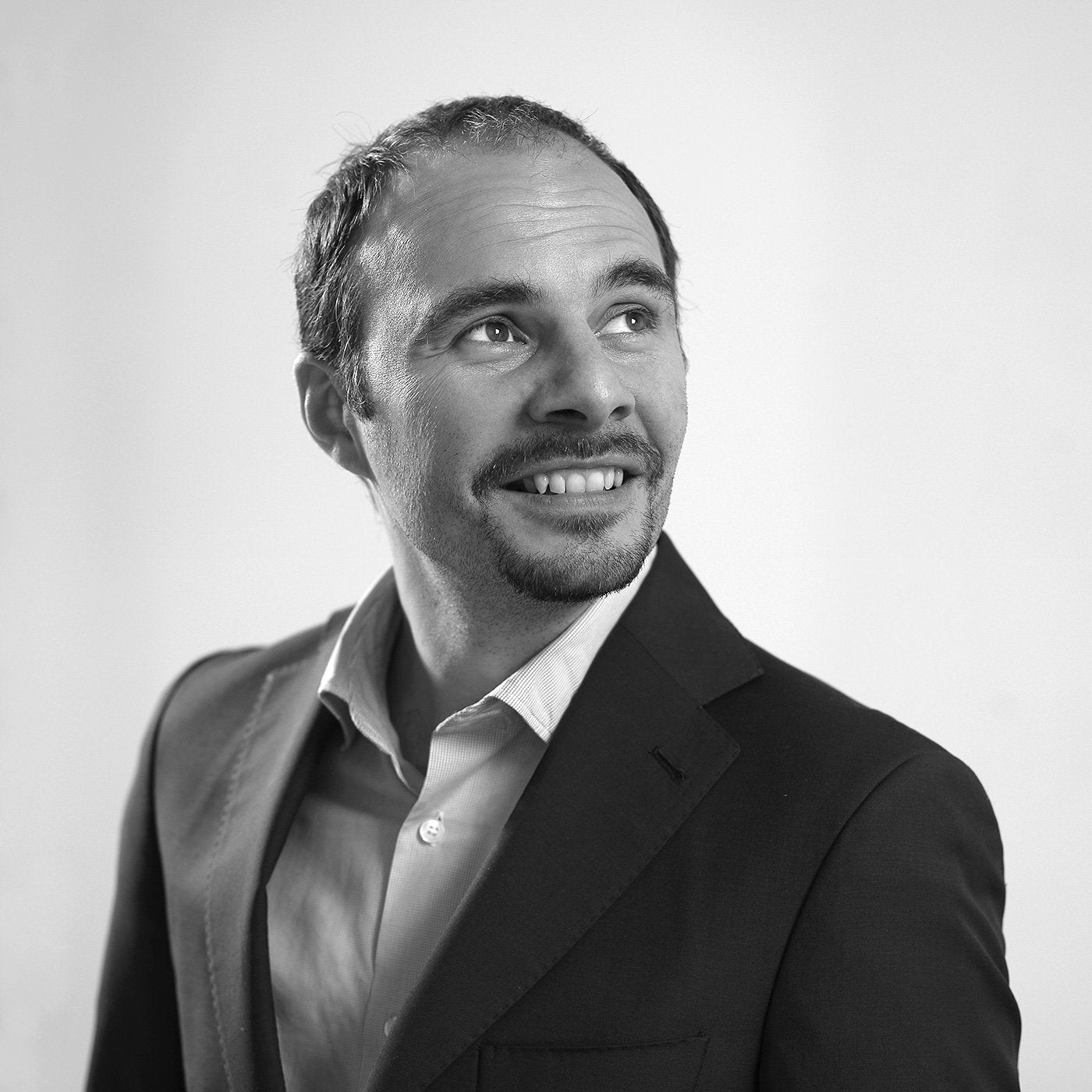 Portrait of designer Emmanuel Gallina, known for his refined, modern Italian furniture designs featured at JANGEORGe Interior Design & Furniture.