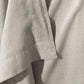 Detail view of the soft hem and warm texture of the Smir flat sheet in a light garment-dyed finish.