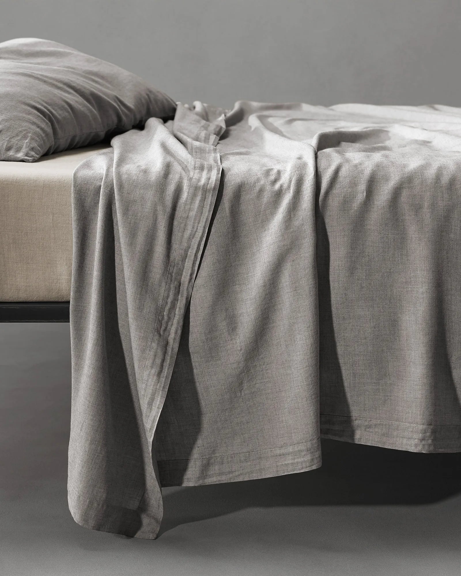 Society Limonta Smir flat sheet in Grano grey featuring a luxurious soft wash finish designed for winter comfort.