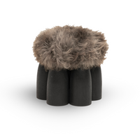 Senufo Ottoman by Arno DeClercq featuring Black African Walnut and Sheep Wool seating.