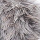 Close-up view of soft, textured sheep wool used in the Senufo Ottoman design by Arno DeClercq.