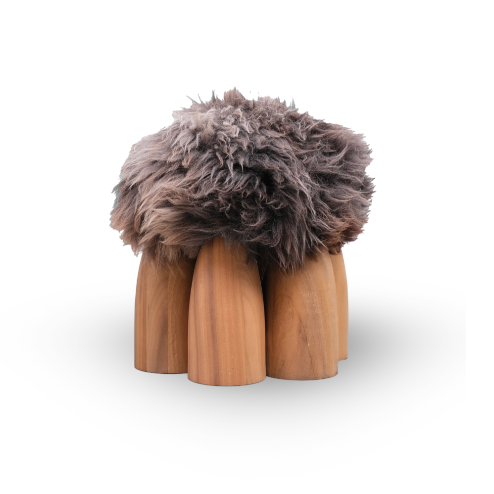Senufo Ottoman designed by Arno DeClercq with rounded legs in Black African Walnut and fluffy Sheep Wool seat.