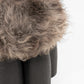 Senufo Ottoman featuring a plush sheep wool top and a sculptural base made of Black African Walnut.