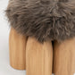 Senufo Ottoman designed by Arno DeClercq featuring rounded legs in French Oak and Sheep Wool upholstery.