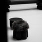 Senufo Ottoman by Arno DeClercq in Black African Walnut with Sheep Wool, showcasing a sculptural design.