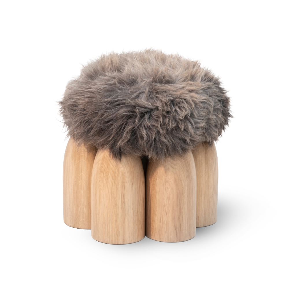 Senufo Ottoman by Arno DeClercq featuring natural sheep wool and Black African Walnut legs.