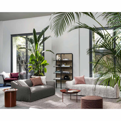 Gervasoni Saia 10 Sofa in living room set up with plants. Pictured with Gervasoni Daen 72 Bookshelf. Couch | JANGEORGe Interiors & Furniture USA