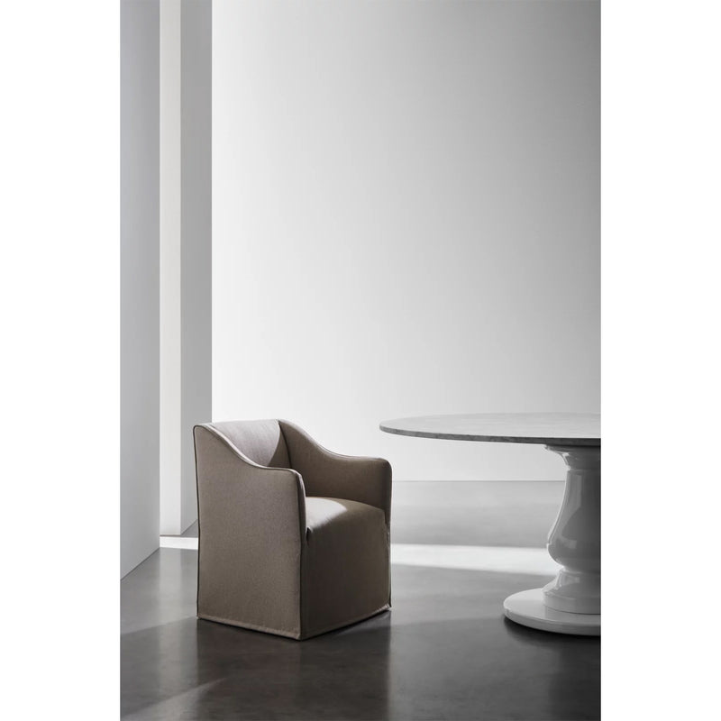 Gervasoni Saia 25 Armchair (partial side view). Pictured with round, marble top table. Chairs USA.