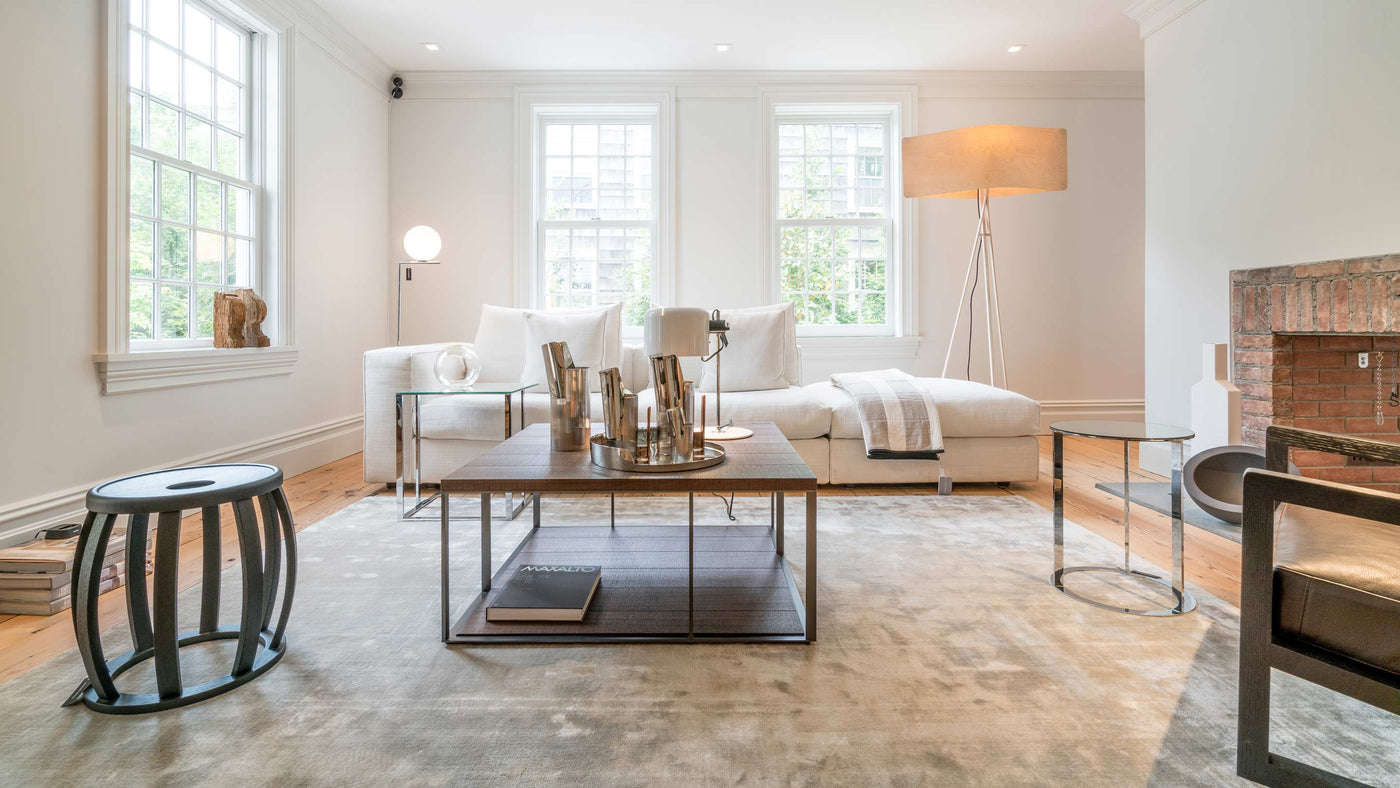 JANGEORGe Interiors & Furniture Maxalto and B&B Italia Sofa, Armchair, Side Tables and Coffee Table, on a GT Design rug. Antique accessories combined with Kose Milano Vases in the rear living room of JAN and GEORGE private residence in Sag Harbor New York