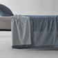 Society Limonta Nim bed sheet and pillowcase styled on a bed, featuring a casual luxury look with garment-dyed Italian cotton.